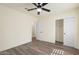 This bedroom features a ceiling fan, closet, and neutral paint for a modern aesthetic at 3021 N Randolph Rd, Phoenix, AZ 85014