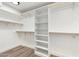 Walk-in closet featuring built-in shelving and clothing rods at 3021 N Randolph Rd, Phoenix, AZ 85014