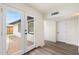 Hallway with wood flooring, a view of the backyard, and access to the pool at 3021 N Randolph Rd, Phoenix, AZ 85014