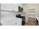 Modern kitchen features white cabinets, quartz countertops, stainless appliances and wood look floors at 3021 N Randolph Rd, Phoenix, AZ 85014