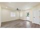 A well-lit living room has an exit door, and neutral paint for a modern aesthetic at 3021 N Randolph Rd, Phoenix, AZ 85014