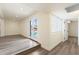This open living room with neutral paint exits to a pool and backyard area at 3021 N Randolph Rd, Phoenix, AZ 85014