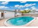 Backyard view features an in-ground pool surrounded by a concrete patio at 3021 N Randolph Rd, Phoenix, AZ 85014