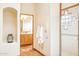 Bathroom transition featuring a linen cabinet, tile flooring, and seamless access to a shower at 30600 N Pima Rd # 38, Scottsdale, AZ 85266