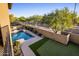 Inviting backyard with a sparkling pool and putting green at 3737 E Donald Dr, Phoenix, AZ 85050