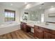 Large bathroom with a double sink vanity and separate shower and bath at 3737 E Donald Dr, Phoenix, AZ 85050