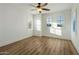 Clean bedroom featuring neutral walls, hard floors and lots of light at 3737 E Donald Dr, Phoenix, AZ 85050
