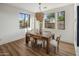 Inviting dining room featuring a wooden table, stylish chairs, and ample natural light at 3737 E Donald Dr, Phoenix, AZ 85050