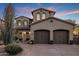 Stunning two-story home with a three car garage, well manicured desert landscaping, and stone accents at 3737 E Donald Dr, Phoenix, AZ 85050