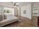Spacious main bedroom features an attached sitting room, walk-in closet, and laminate floors at 3737 E Donald Dr, Phoenix, AZ 85050
