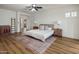 Bright and airy main bedroom with wood floors and modern furnishings at 3737 E Donald Dr, Phoenix, AZ 85050