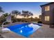 Inviting backyard pool with basketball hoop and putting green provides fun and recreation at 3737 E Donald Dr, Phoenix, AZ 85050