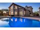 Relaxing backyard pool with home in the background provides resort-style living at 3737 E Donald Dr, Phoenix, AZ 85050