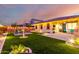 Spacious backyard features a patio, artificial turf, and an outdoor kitchen area at 3739 S 180Th Dr, Goodyear, AZ 85338