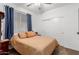Cozy bedroom with ceiling fan, window with blinds, and a closet at 3739 S 180Th Dr, Goodyear, AZ 85338