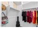 Organized walk-in closet with shelving, hanging rods, and personal items displayed at 3739 S 180Th Dr, Goodyear, AZ 85338