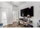 Home office setup with desk, computer equipment, and mounted television at 3739 S 180Th Dr, Goodyear, AZ 85338