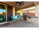 Spacious covered patio with a built-in grill and ample seating, perfect for outdoor cooking and relaxation at 3739 S 180Th Dr, Goodyear, AZ 85338