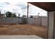 Spacious backyard featuring a block wall and metal gate, ideal for landscaping and outdoor activities at 3822 N 48Th Dr, Phoenix, AZ 85031