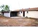 Backyard featuring a covered patio and a house with a brown shingled roof at 3822 N 48Th Dr, Phoenix, AZ 85031