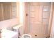 Clean, white bathroom with a modern shower and white sink at 3822 N 48Th Dr, Phoenix, AZ 85031
