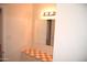 Bathroom showing tiled countertop, mirror and vanity lighting at 3822 N 48Th Dr, Phoenix, AZ 85031