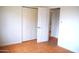 Bright bedroom featuring a closet and unique orange-colored tile flooring at 3822 N 48Th Dr, Phoenix, AZ 85031