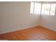 Bedroom with brick walls, window and tile flooring at 3822 N 48Th Dr, Phoenix, AZ 85031