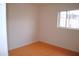 Bright bedroom with a window and unique orange-colored tile flooring at 3822 N 48Th Dr, Phoenix, AZ 85031