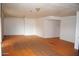 Spacious living room with unique orange-colored tile flooring and neutral walls at 3822 N 48Th Dr, Phoenix, AZ 85031