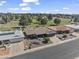 Desirable neighborhood with mature trees, showcasing the home's proximity to a lush golf course at 4055 E Catalina Cir, Mesa, AZ 85206