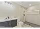 Modern bathroom featuring sleek vanity, toilet, and glass-enclosed shower with neutral tile surround and a recessed shelf at 4055 E Catalina Cir, Mesa, AZ 85206
