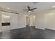 Spacious bedroom with a ceiling fan, and access to en-suite bathroom through sliding barn door at 4055 E Catalina Cir, Mesa, AZ 85206