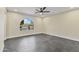 Bright bedroom with arched window providing ample natural light and a ceiling fan at 4055 E Catalina Cir, Mesa, AZ 85206