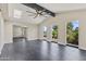 Spacious living area with vaulted ceilings, skylight, and large windows showcasing the outdoor views at 4055 E Catalina Cir, Mesa, AZ 85206