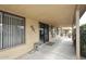 Covered back porch with windows, stucco walls, and outdoor electrical outlets at 416 Leisure World --, Mesa, AZ 85206