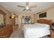 Comfortable bedroom with wood furnishings, neutral walls and a zebra-striped throw blanket at 416 Leisure World --, Mesa, AZ 85206