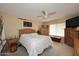 Cozy bedroom with a ceiling fan, window blinds, and wood furnishings throughout at 416 Leisure World --, Mesa, AZ 85206