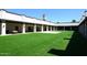 Artificial grass courtyard framed by a portico with beautiful archways at 416 Leisure World --, Mesa, AZ 85206