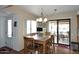Charming dining room with a wooden table and chairs, sliding door access to patio at 416 Leisure World --, Mesa, AZ 85206