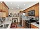 Well-equipped kitchen with wood cabinets, granite countertops, and stainless steel appliances at 416 Leisure World --, Mesa, AZ 85206