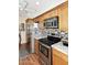 Bright kitchen features stainless steel appliances, tile backsplash, and beautiful countertops at 416 Leisure World --, Mesa, AZ 85206
