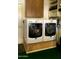 Efficient laundry room features a modern, side-by-side washer and dryer setup, maximizing space and convenience at 416 Leisure World --, Mesa, AZ 85206