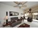 Cozy living room with comfortable seating, neutral decor, and a ceiling fan at 416 Leisure World --, Mesa, AZ 85206