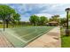 Well-maintained community basketball court offers recreation and exercise in a green space with mature trees at 4289 E Jasper Dr, Gilbert, AZ 85296