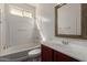 Bathroom with a vanity with cherry wood cabinets, tub, shower, and toilet at 4289 E Jasper Dr, Gilbert, AZ 85296