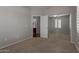 Bedroom featuring neutral walls, carpet, closet with mirrored doors, and view to bathroom at 4289 E Jasper Dr, Gilbert, AZ 85296
