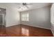 Spacious bedroom with hardwood flooring, a ceiling fan, and bright natural light at 4289 E Jasper Dr, Gilbert, AZ 85296