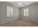 Bedroom featuring neutral walls, carpet floors, and windows with white shutters at 4289 E Jasper Dr, Gilbert, AZ 85296