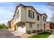 Charming two-story townhome features a stucco exterior, a two-car garage, and a well-manicured lawn at 4289 E Jasper Dr, Gilbert, AZ 85296